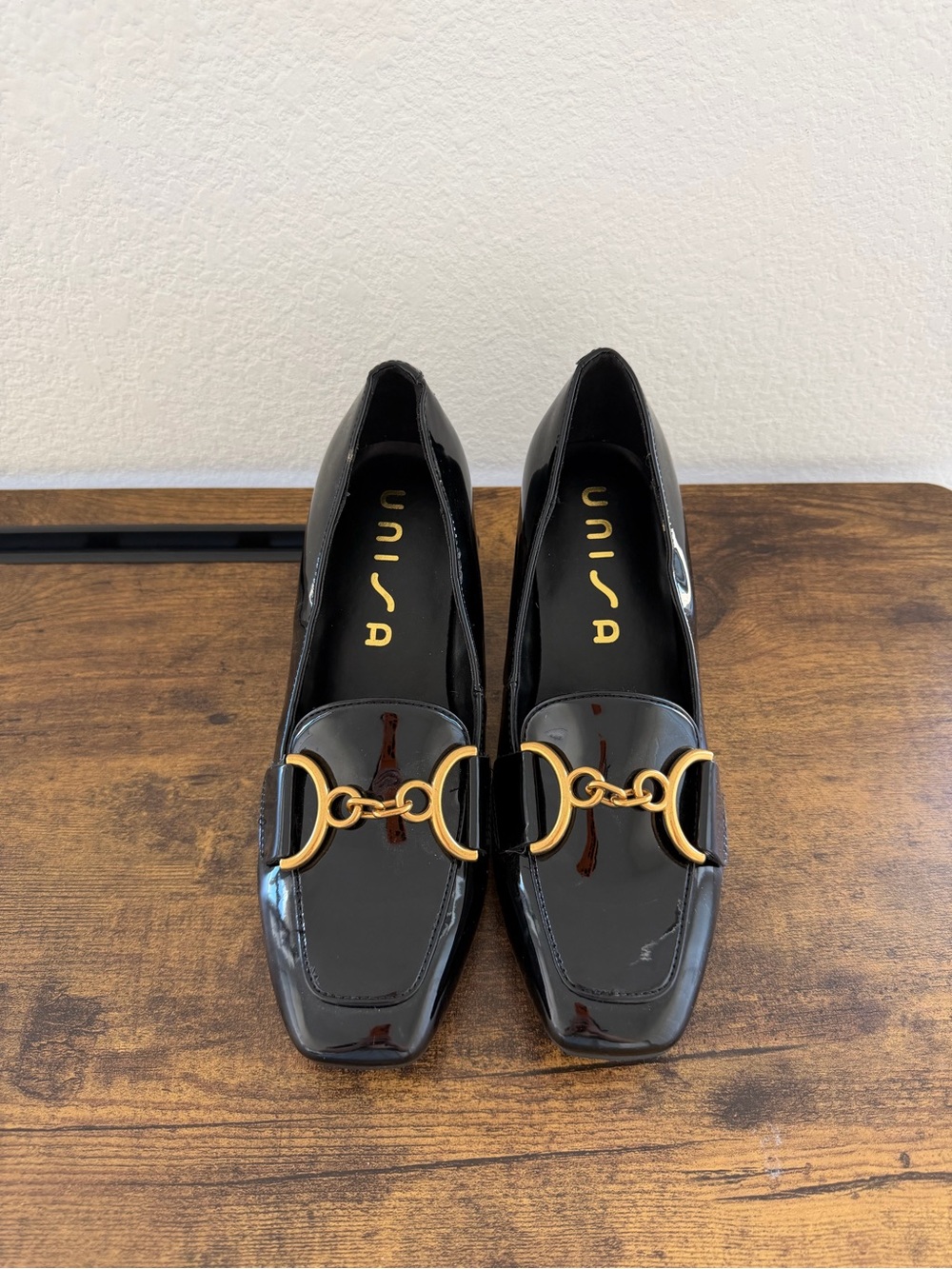 Unisa Black Patent Loafers with Gold Chain Detail
